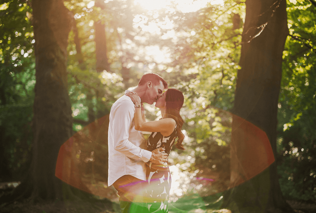 Couple kissing in forrest