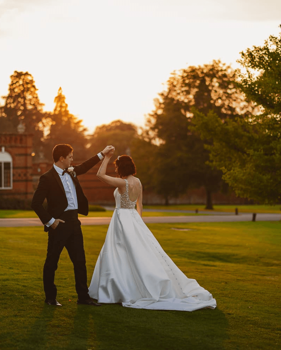 Elvetham Hotel Wedding couple in the fields