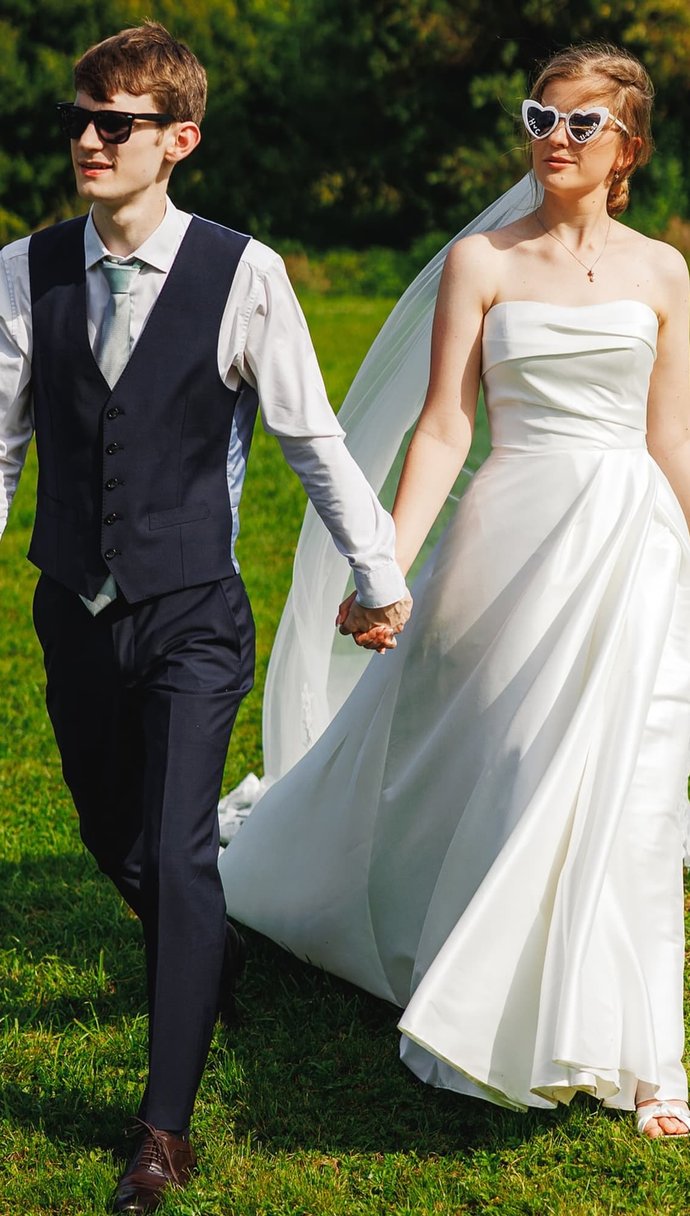 bride and groom laughing in cornfield