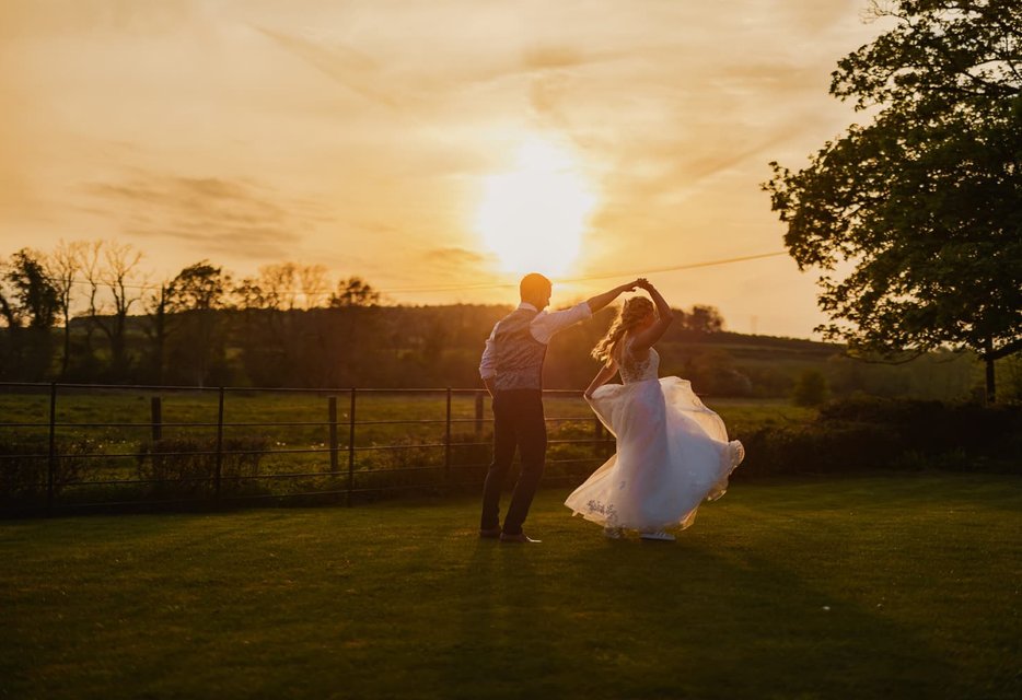 Bride and groom in golden hour light at Syrencot estate