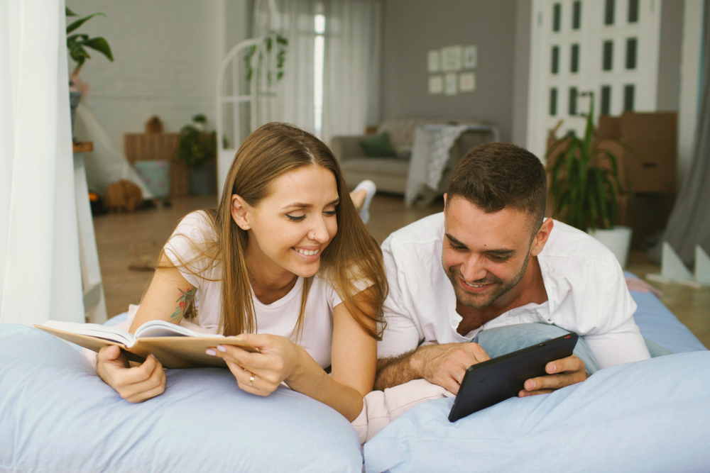 Newlyweds viewing their wedding photos and smiling