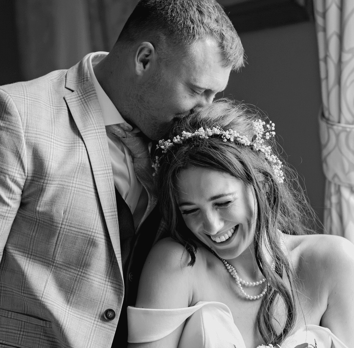 Groom giving bride a kiss