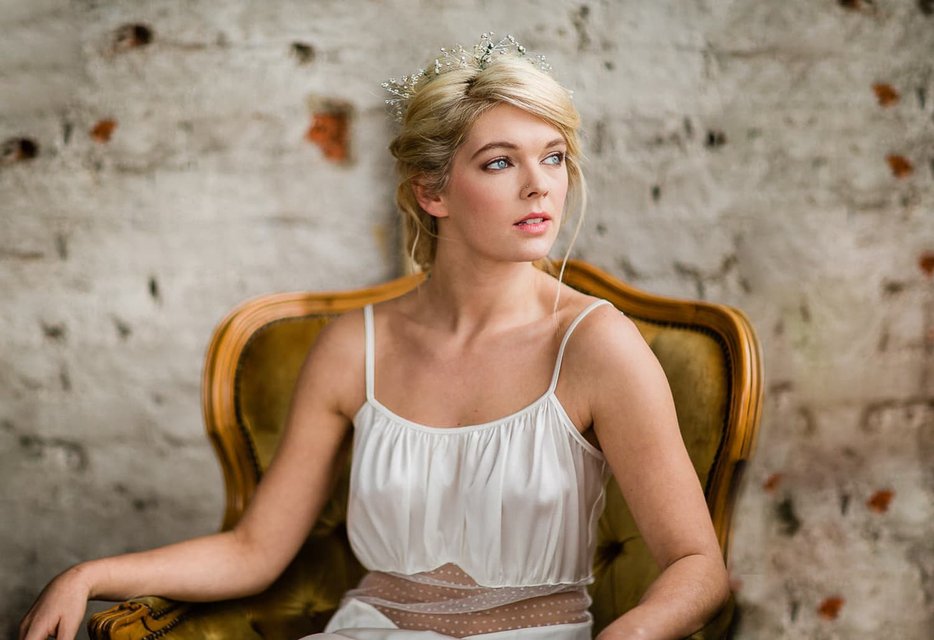 Bride trying on wedding dresses in bridal boutique