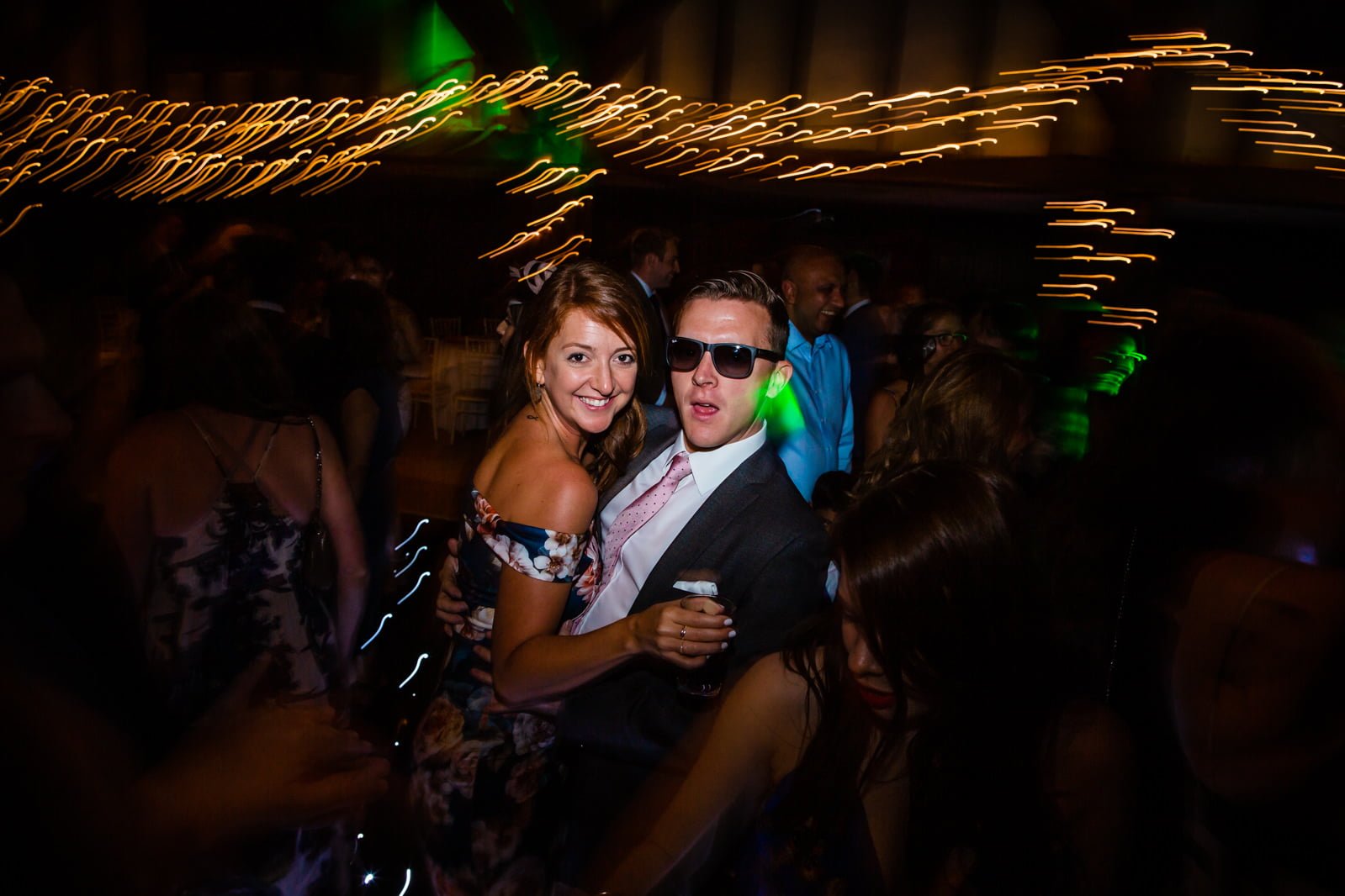 Elegant wedding ceremony at Great Fosters with dramatic lighting
