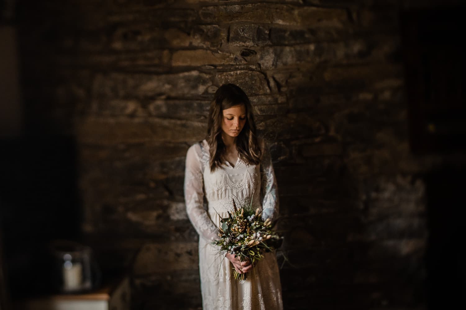 Bride walking through misty mountain landscape