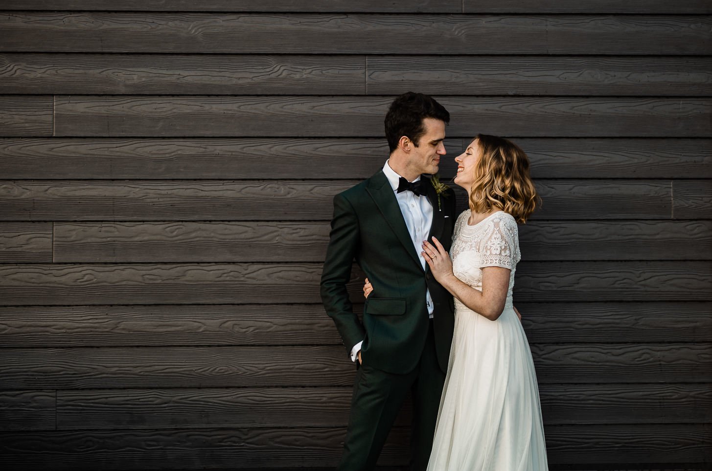 Groom in grey three-piece suit at Denbies Wine Estate wedding