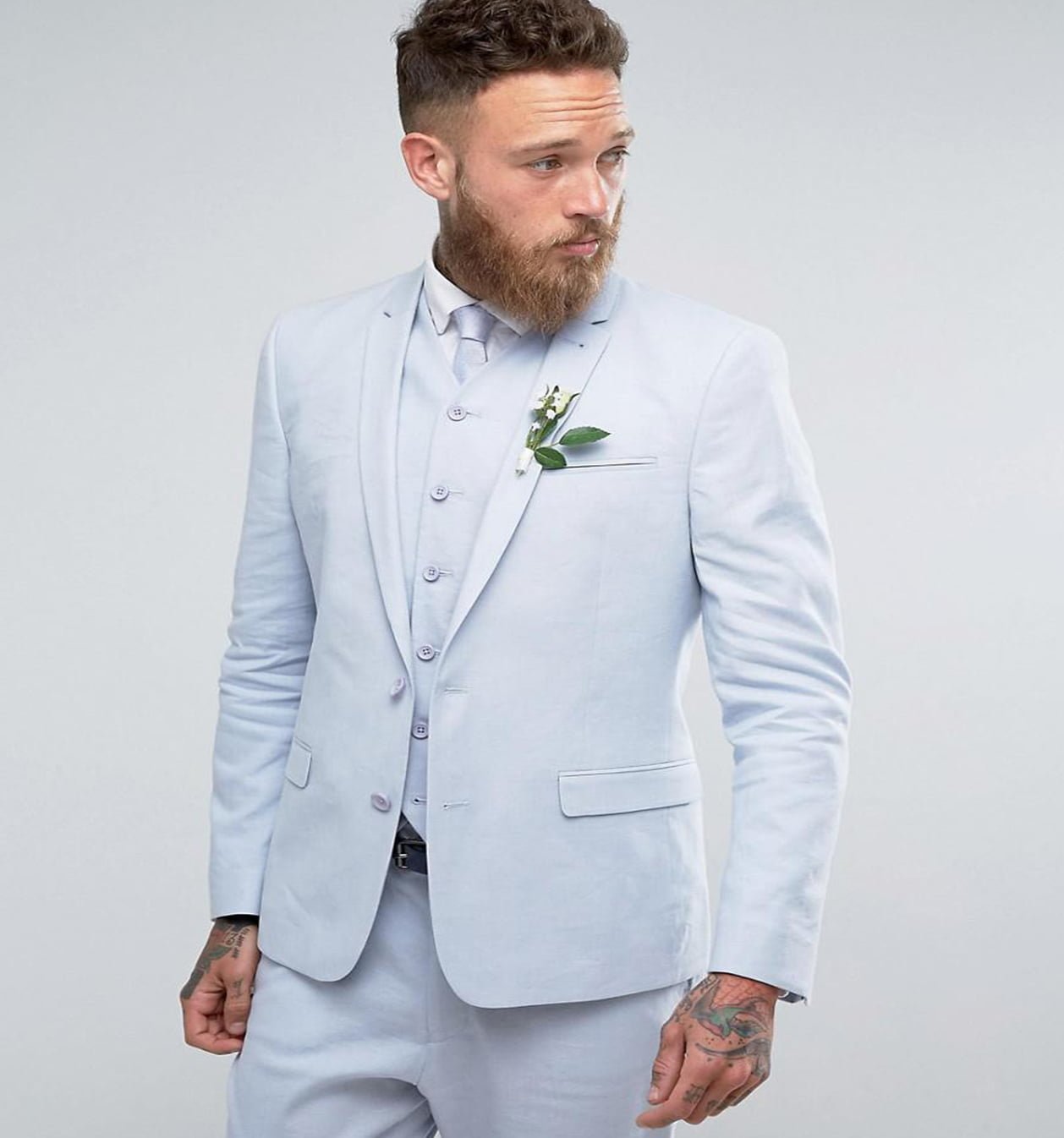 Light blue linen suit worn at beach wedding