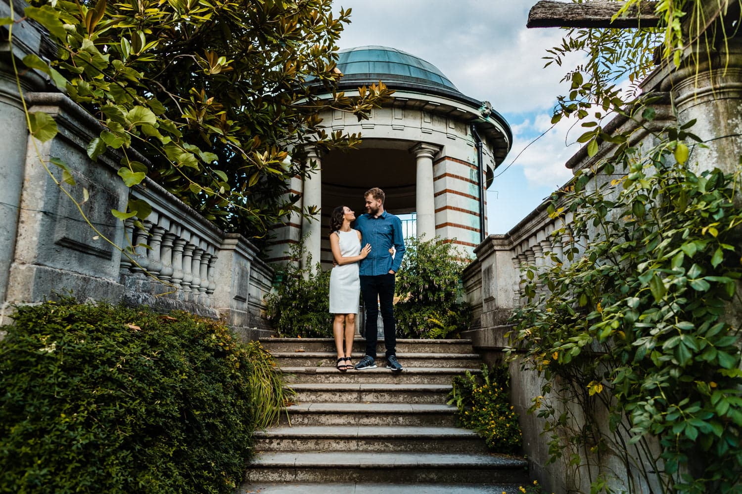 Couple silhouette against sunset through the pergola