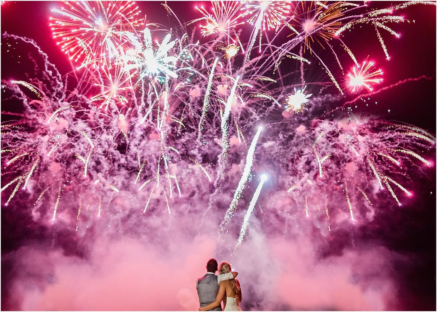 Wedding party outside the church with village backdrop