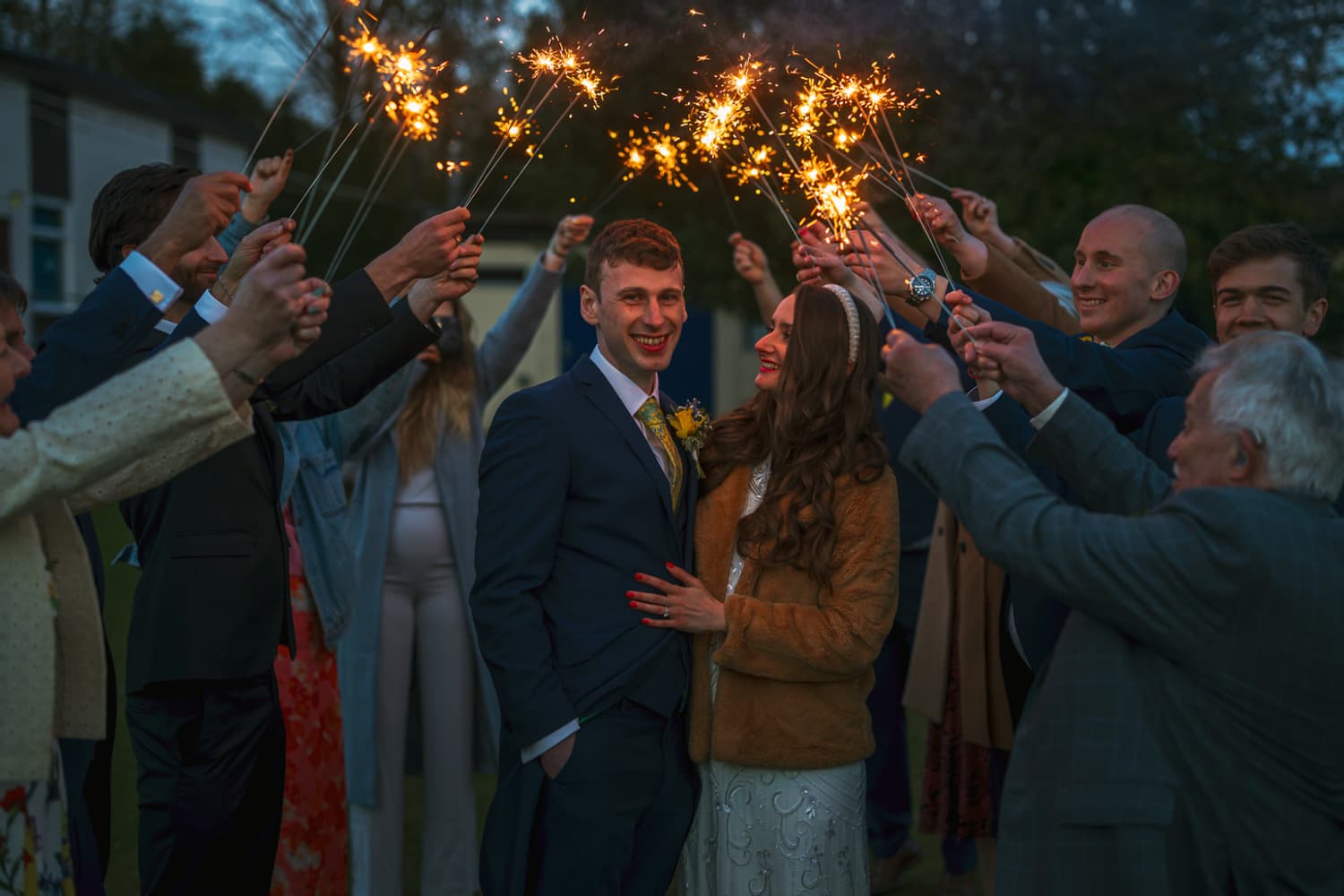 Couple silhouette with sparklers at dusk
