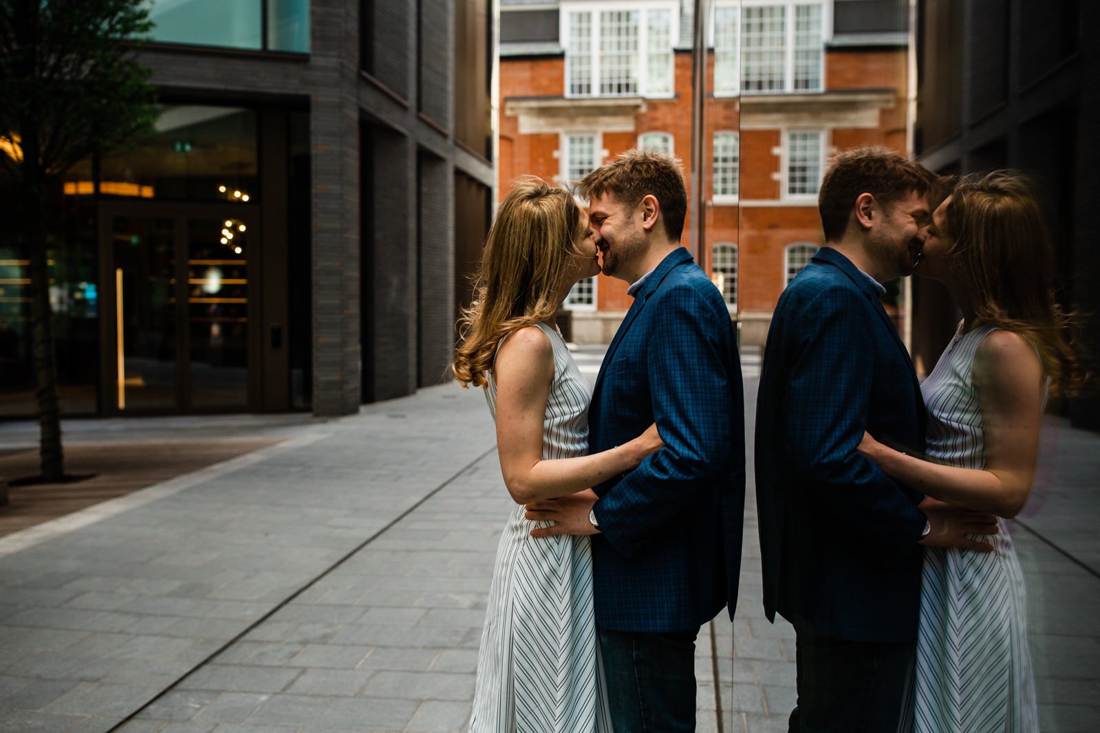 Couple in casual denim and neutral tones at outdoor engagement session
